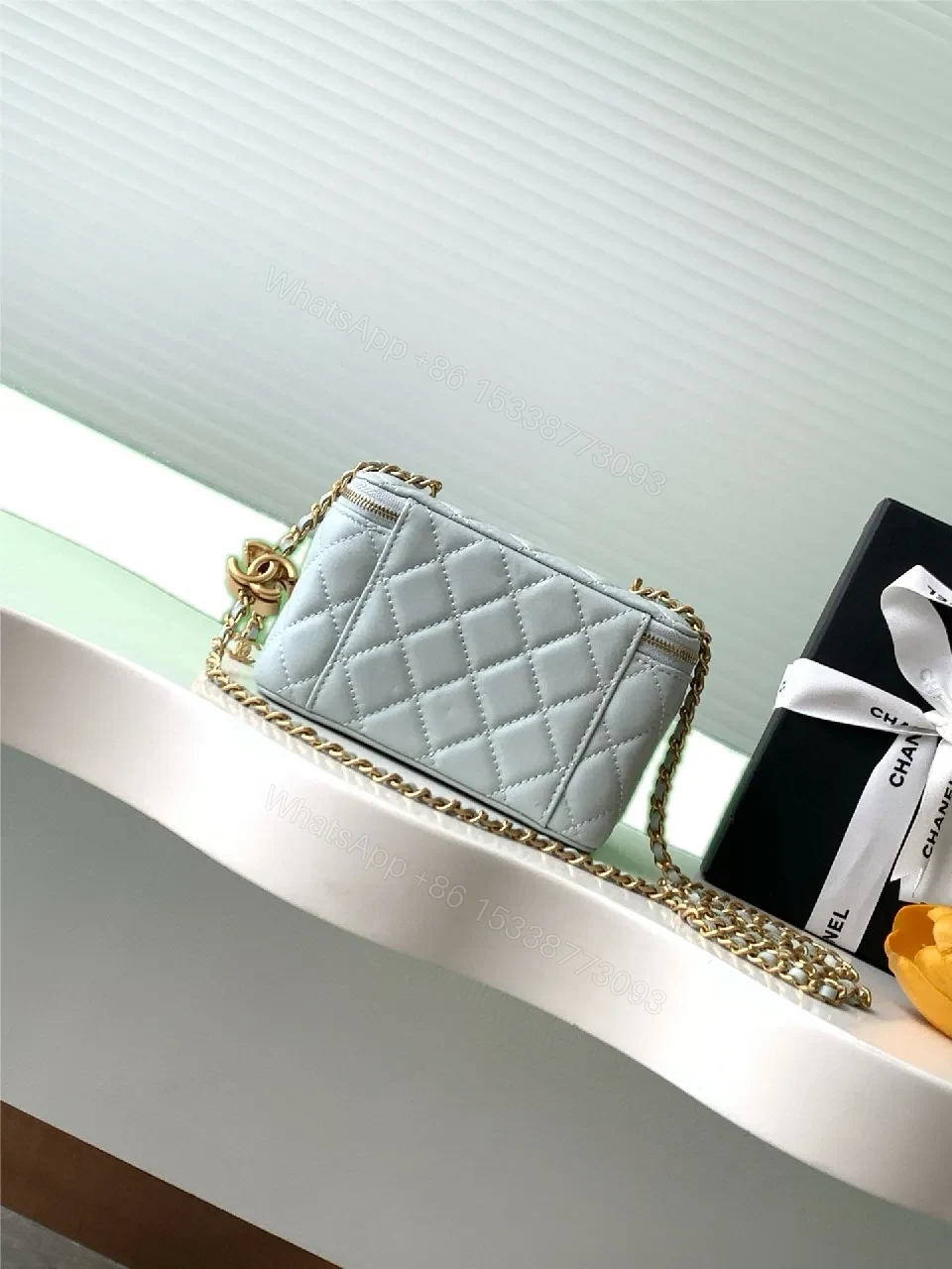 View 8 of Light Blue Quilted Mini Bag with Gold Accents and Chain