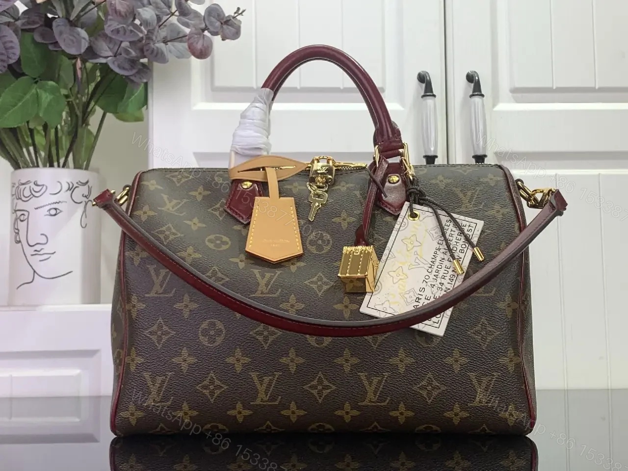 View 4 of Brown Canvas LV Monogram Travel Handbag with Burgundy Leather Trim