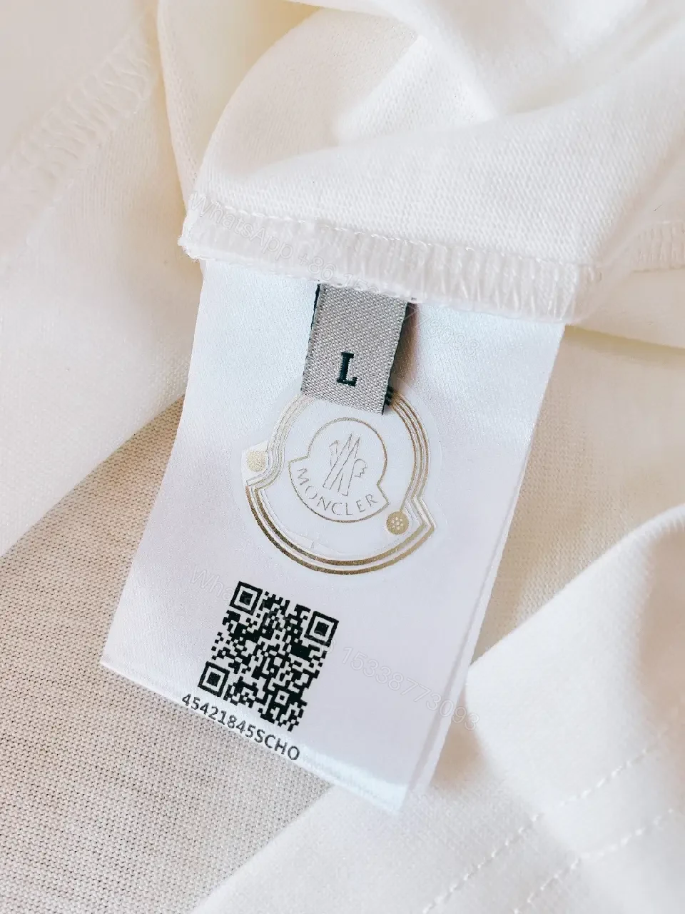 View 9 of White Cotton Logo Tee – Modern Luxury Essential T-Shirt