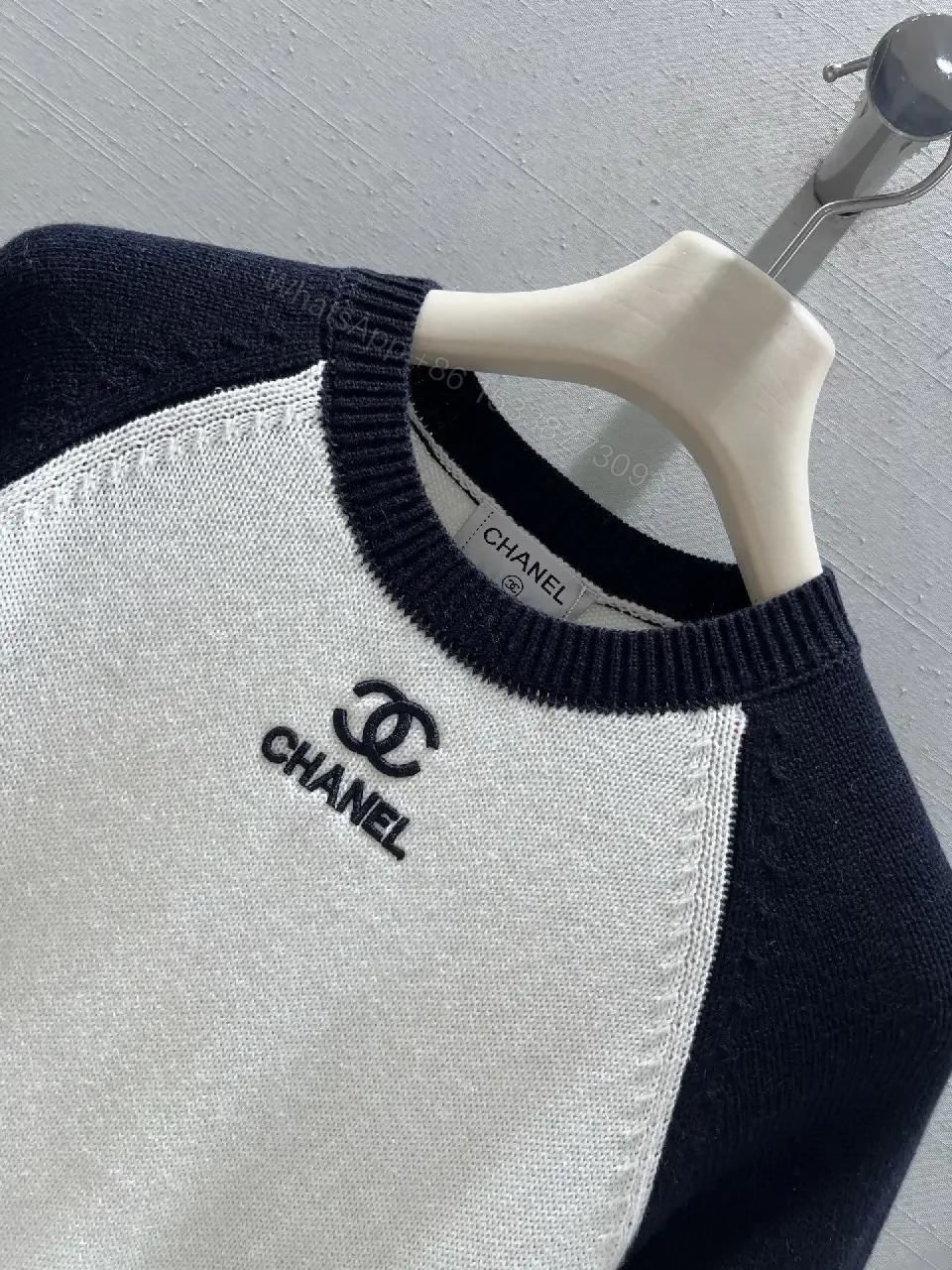 View 6 of Two-Tone Knit Tee with Signature Logo Emblem - Modern Luxury Casual