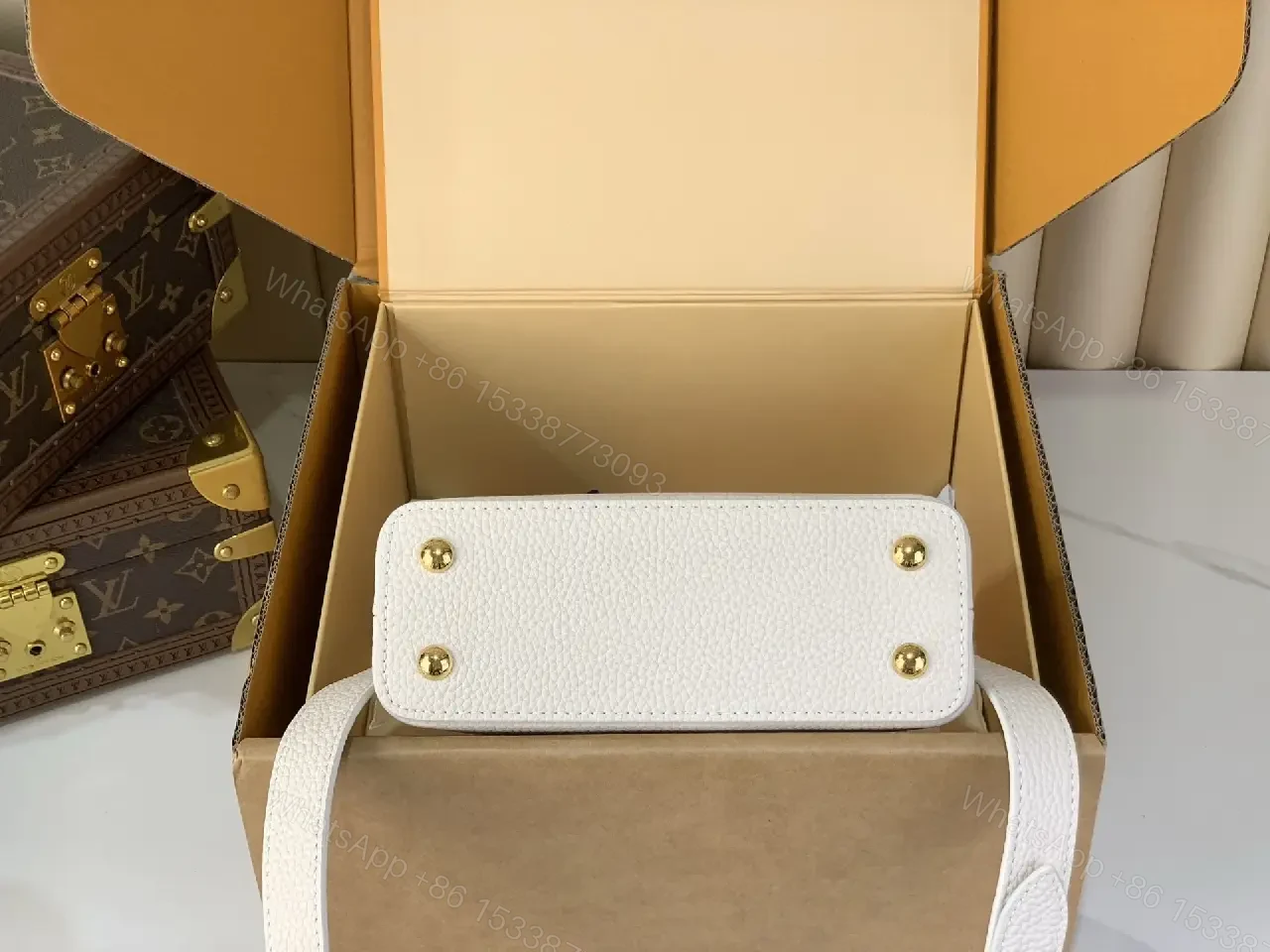 View 3 of Chic Textured Leather Mini Bag with Gold Emblem