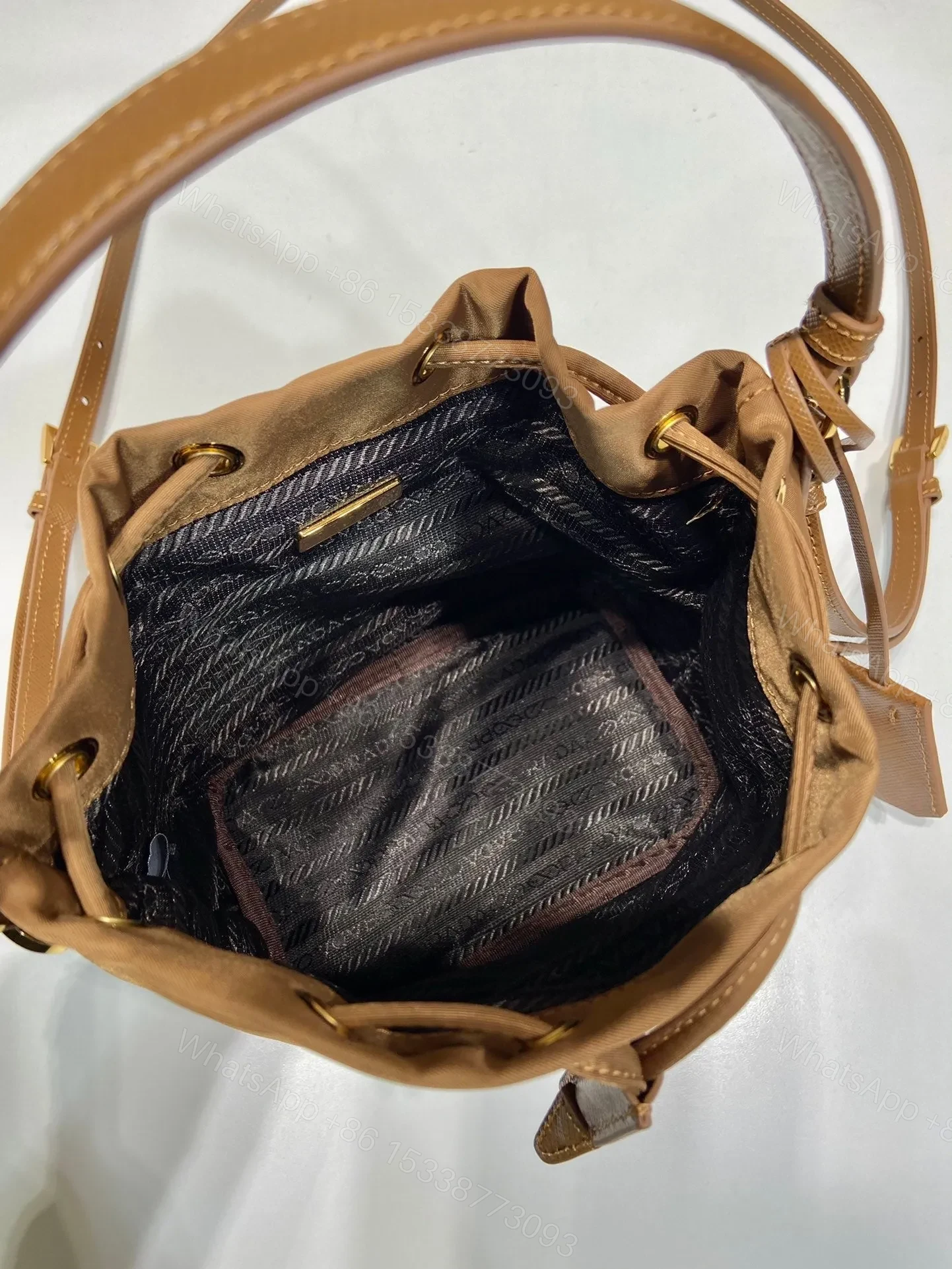 View 4 of BUCKET BAG 19 IN RUSSET BROWN RE-NYLON AND CALFSKIN HANDLE