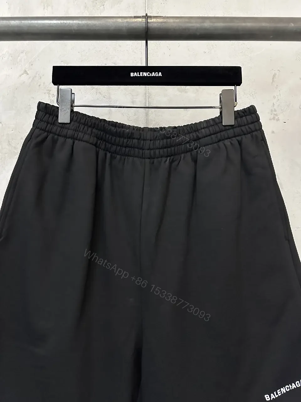 View 2 of black nylon shorts with logo motif for luxury everyday wear