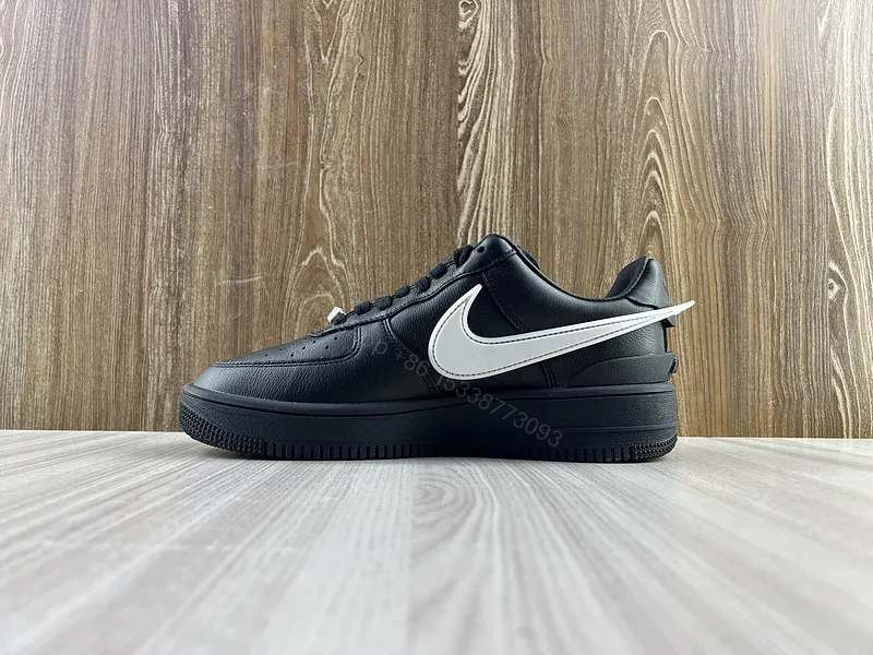 View 11 of Black Leather Low-Top Sneakers with White Swoosh - Luxury Streetwear