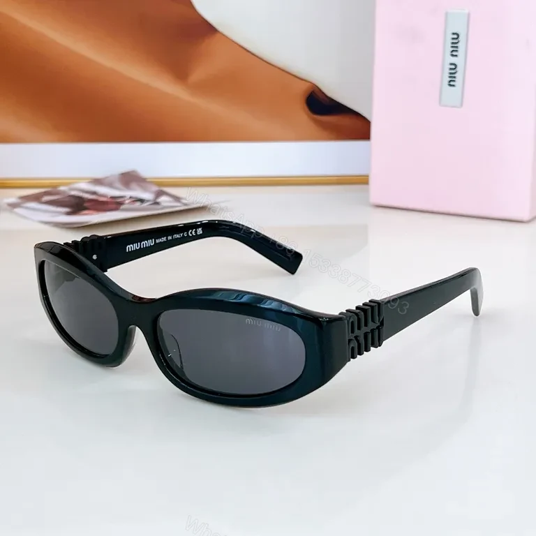 View 9 of Chic Black Miu Miu Sunglasses with Gold Accent - All-Day Shield