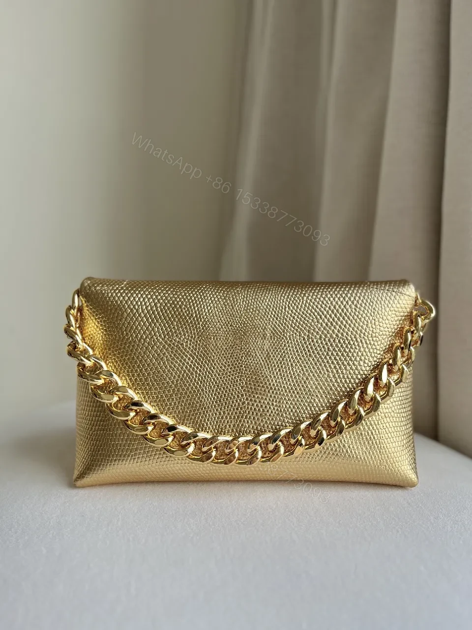 View 3 of Textured Leather Mini Bag with Bold Gold Chain Accent