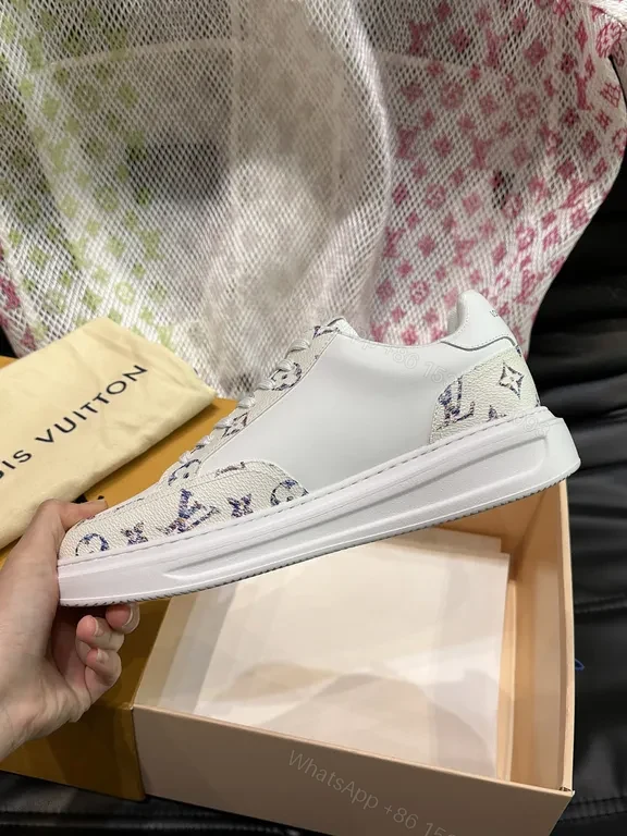 View 4 of Louis Vuitton-Style White Leather Sneakers with Signature Details