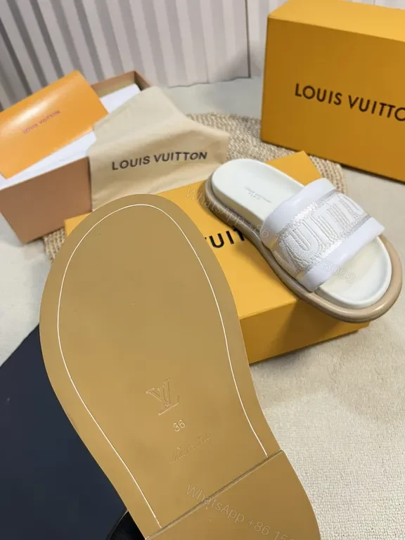 View 3 of Louis Vuitton Luxe Textured Slides with Logo Embellishment