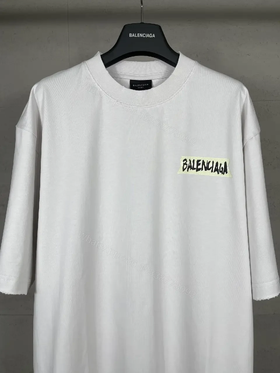 View 10 of Oversized White Tee with Signature Patch - Minimalist Luxe
