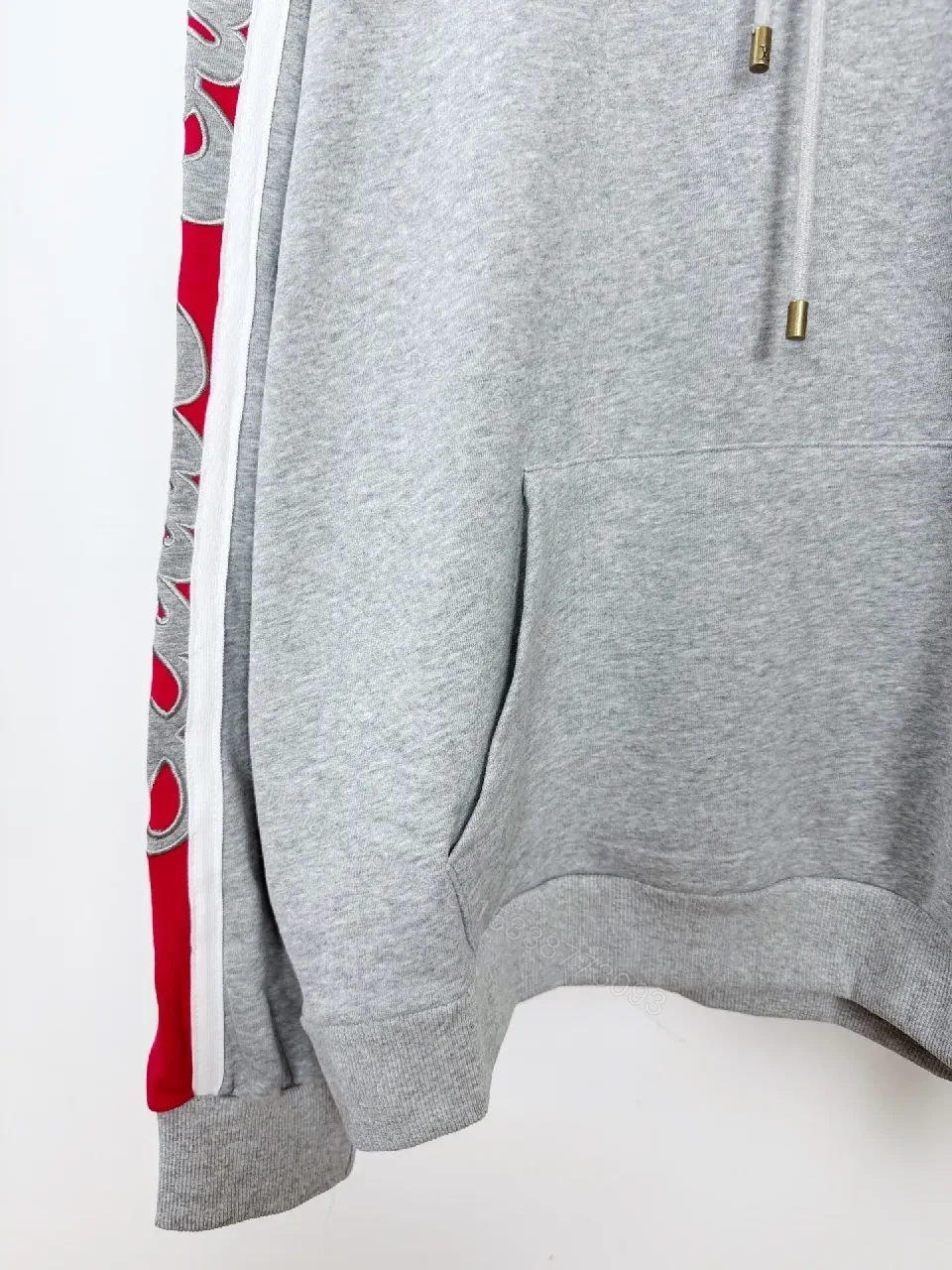View 6 of Grey Mélange Hoodie with Red Tape – Premium Comfort & Embroidery