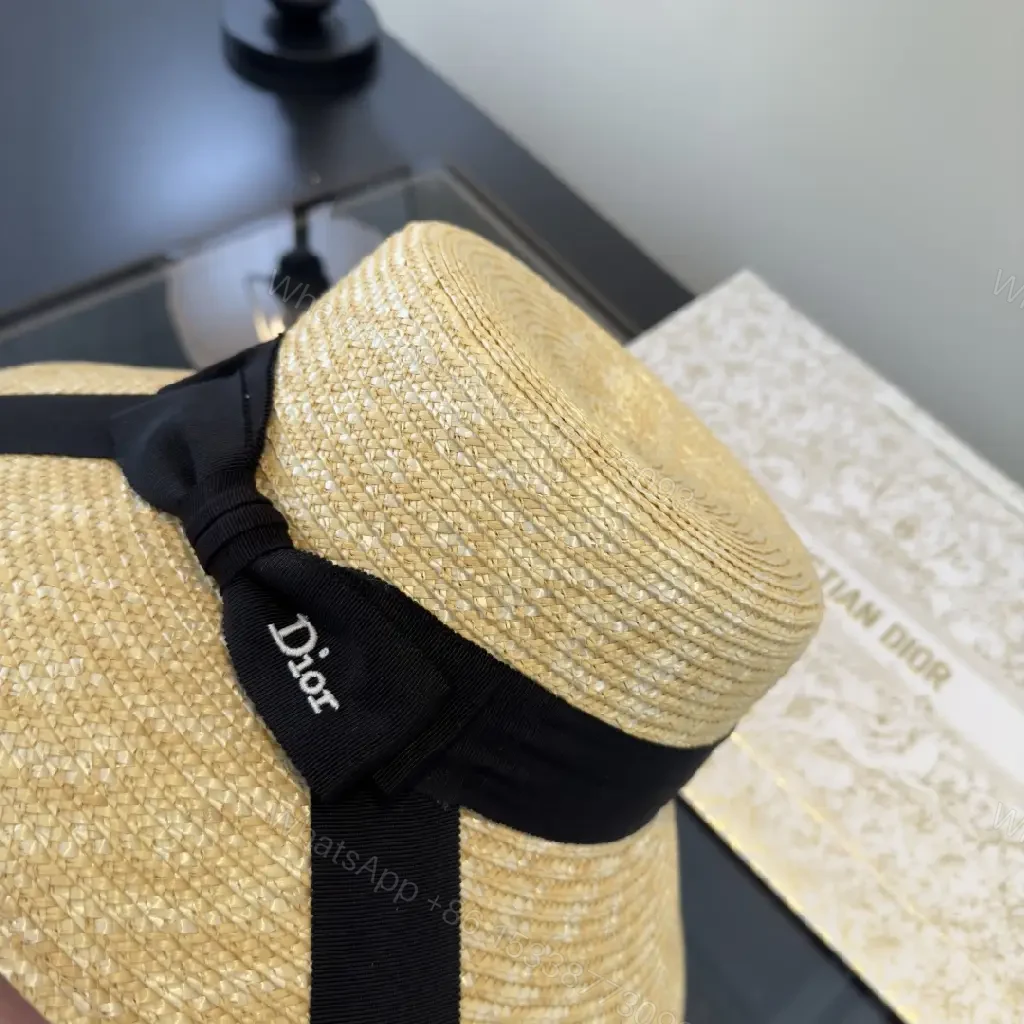 View 6 of Natural Straw Wide-Brim Hat with Black Ribbon Accent