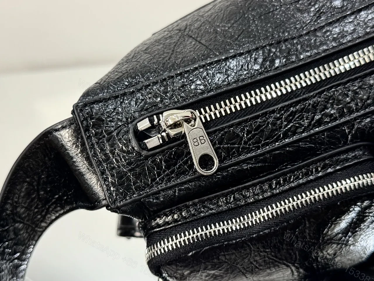 View 2 of Compact Black Leather Messenger Bag: Sleek Crossbody Utility