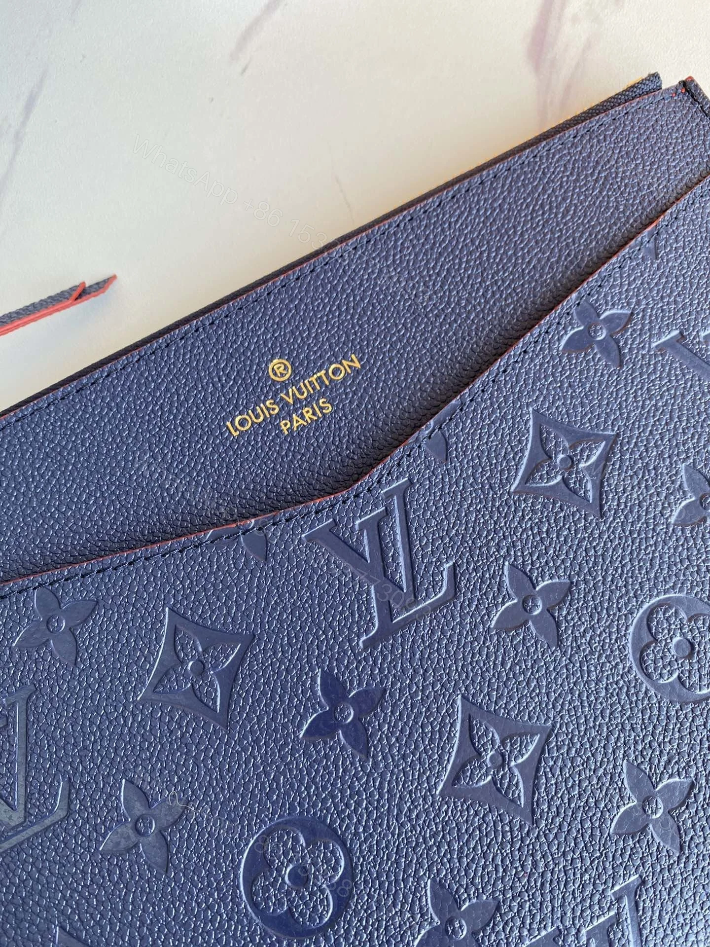 View 8 of Louis Vuitton Marine Rogue Monogram Empreinte Daily Pouch