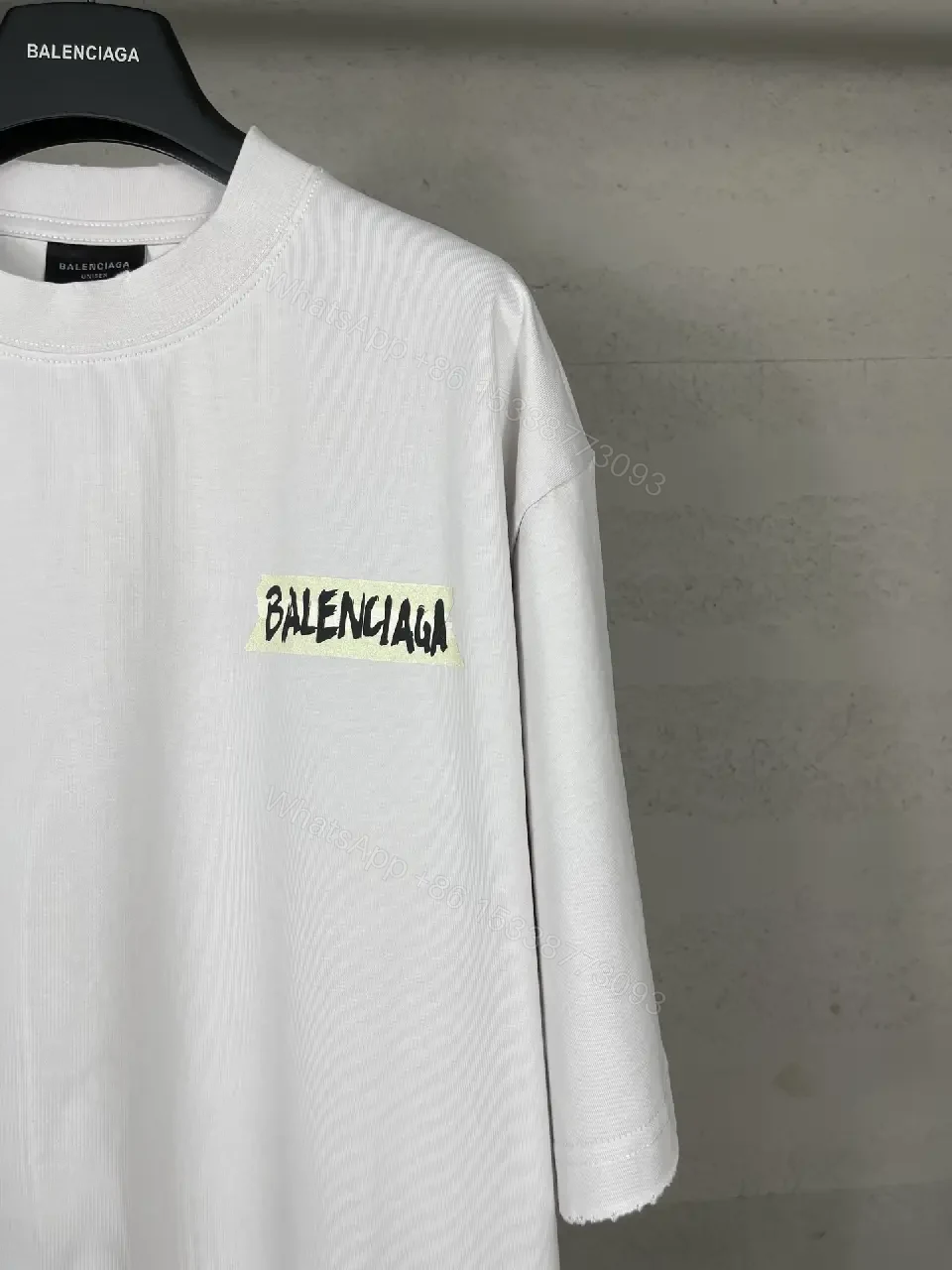 View 3 of Oversized White Tee with Signature Patch - Minimalist Luxe