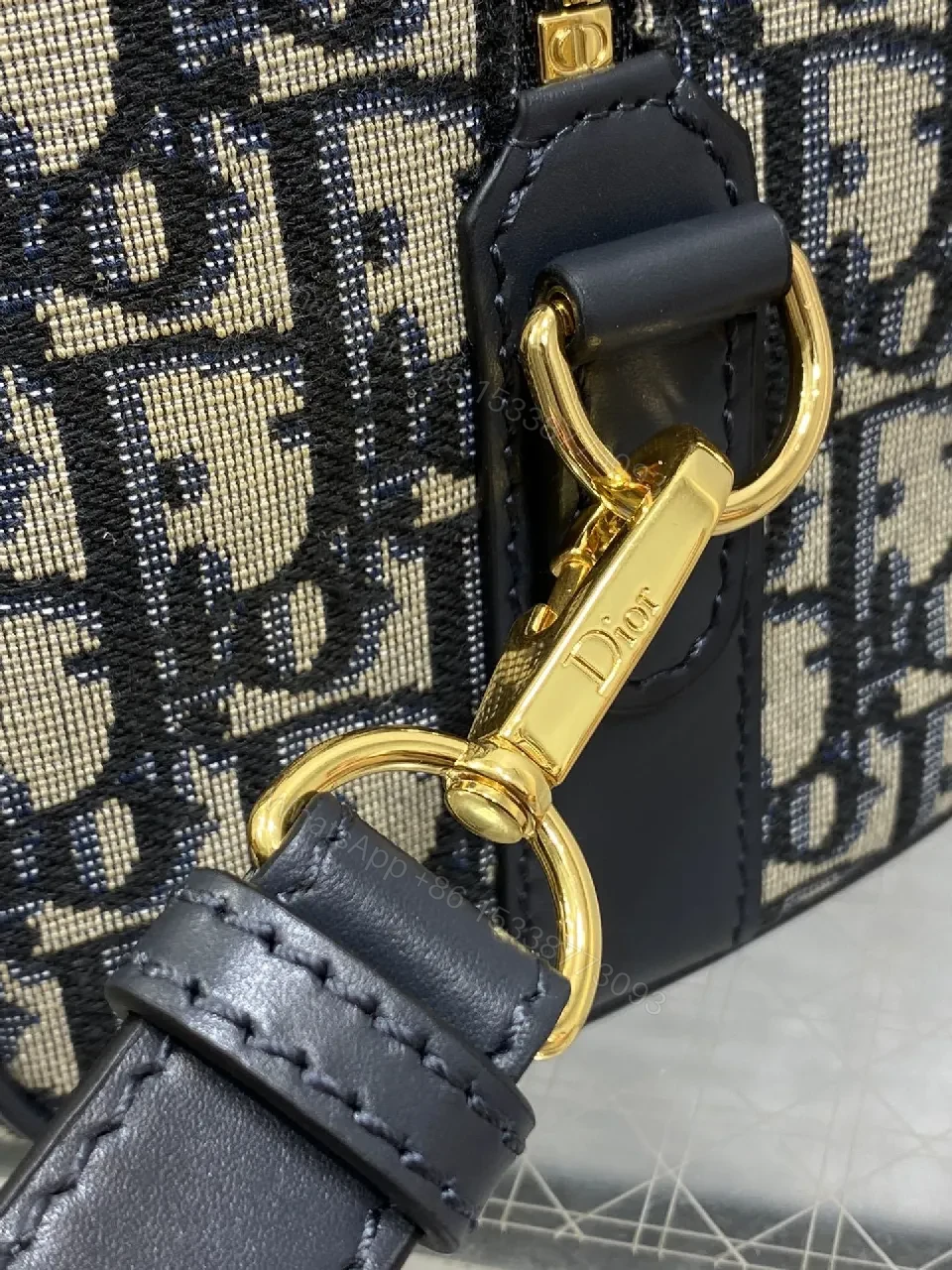 View 4 of Structured Luxe Navy Leather Mini Duffle Bag with Monogram Charm