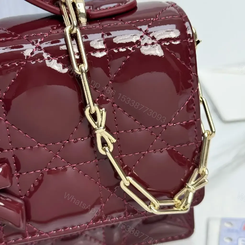 View 10 of Glossy Burgundy Quilted Mini Bag with Bow Accent