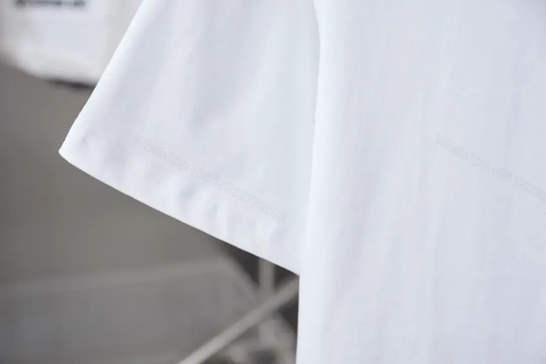 View 5 of Minimalist White Tee with LV Stitch – Premium Everyday Essential