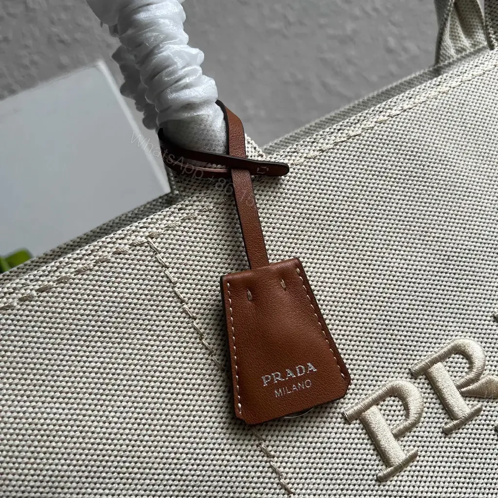 View 10 of Light Beige Canvas Tote Bag with Leather Accents and Structured Silhouette