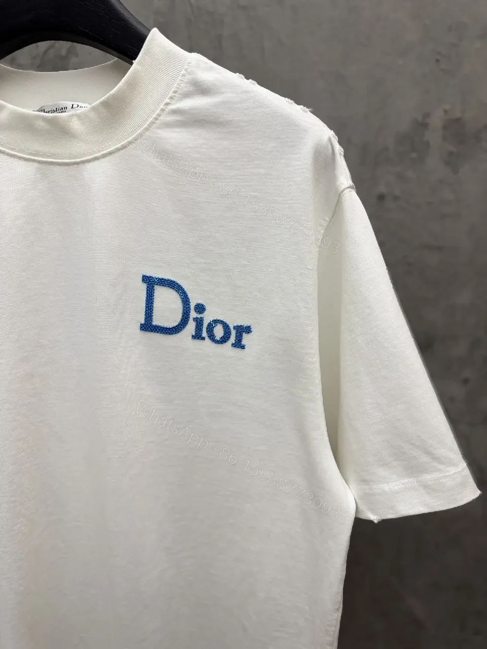 View 6 of Minimalist White Tee with Blue Embroidered Logo, Premium Cotton
