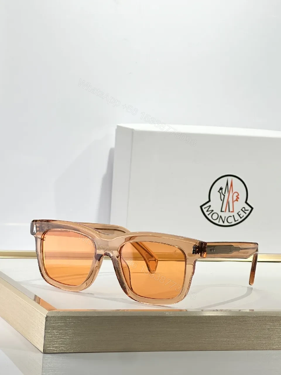 View 4 of Translucent Frame Sunglasses with Amber Lenses and Gold Accents
