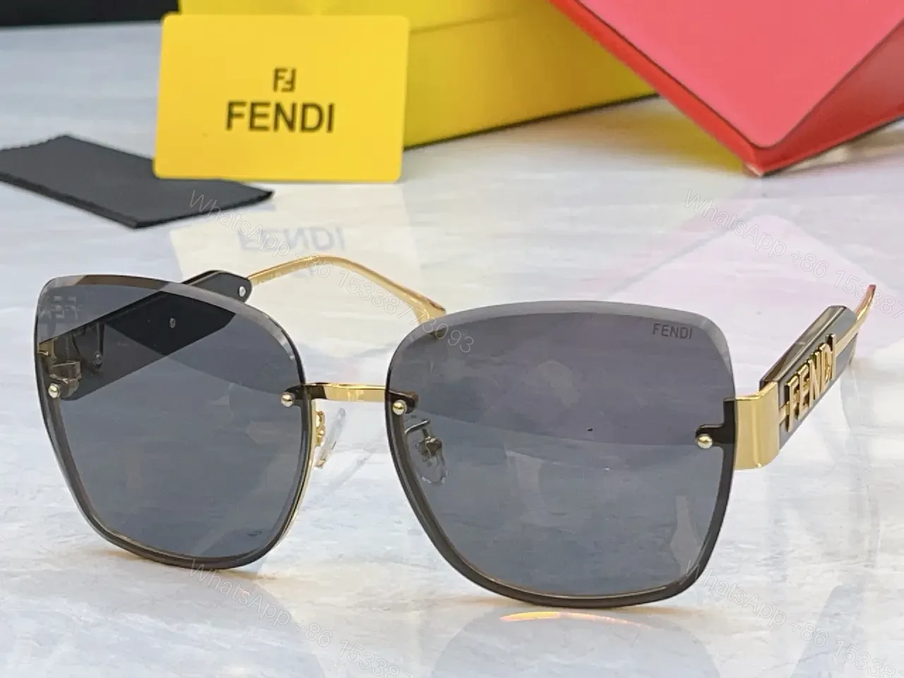 View 6 of Gold Frame Pink Gradient Sunglasses with FENDI Logo