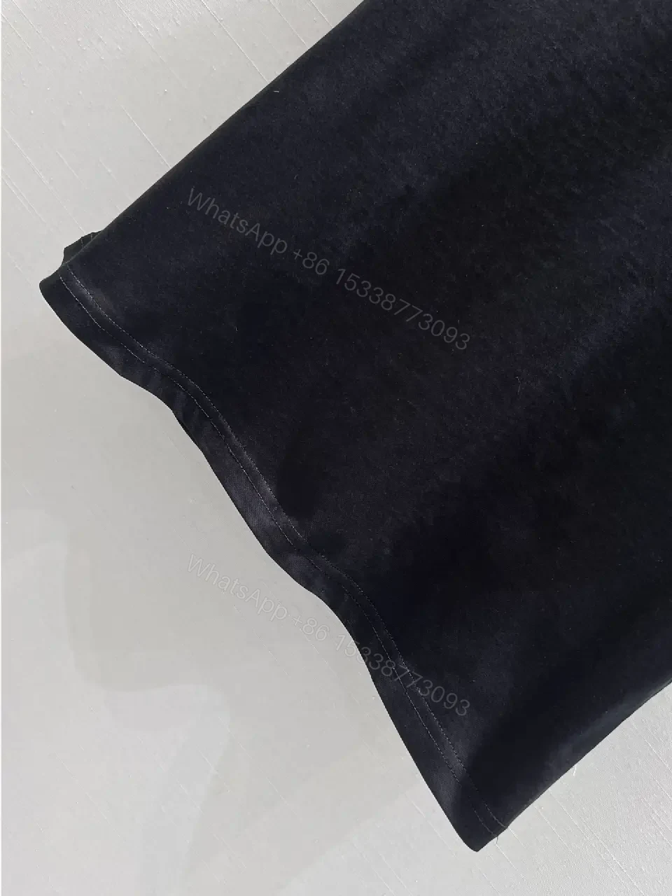 View 9 of Black Cotton Tee with Subtle Embroidered Logo - Luxury Everyday Wear