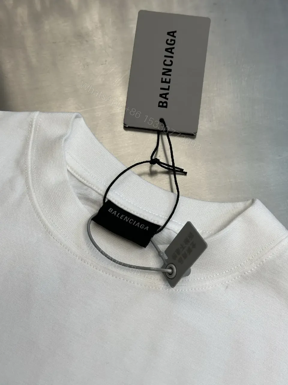 View 10 of Oversized Graphic Tee with Subtle Distress and Logo – Premium Cotton
