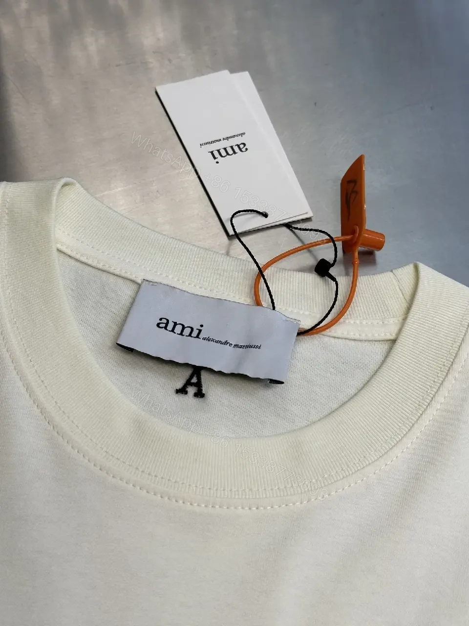 View 5 of Paris Flair Tee: Off-White Cotton Blend, Minimal Crest Graphic