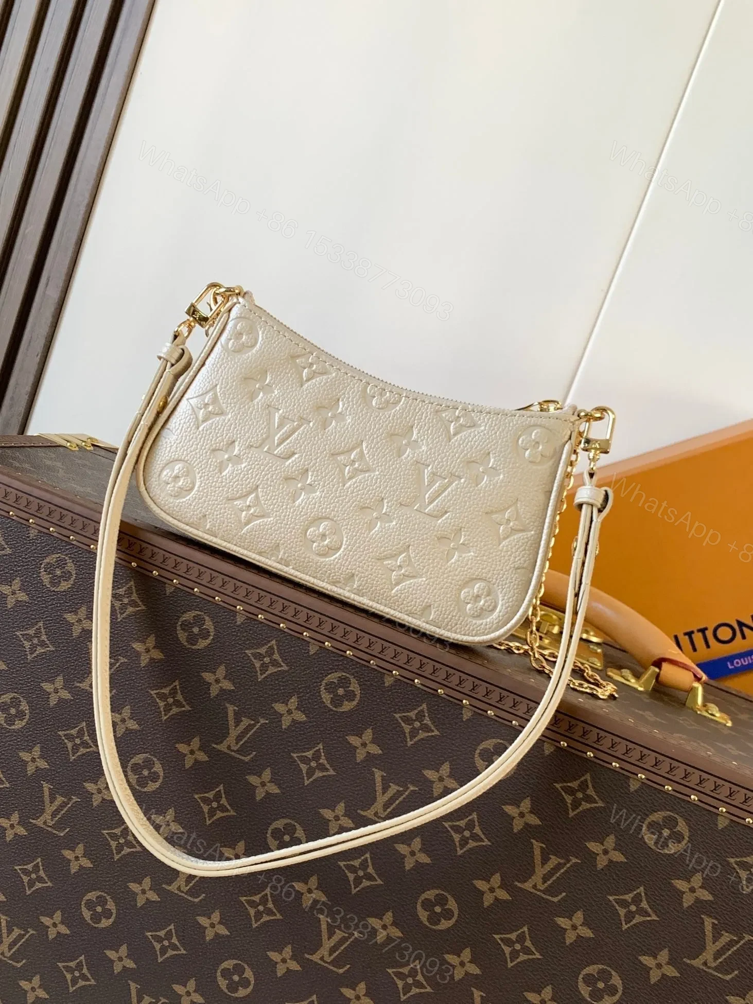 View 2 of LV EASY POUCH ON STRAP 19 IN BEIGE MONOGRAM EMPREINTE LEATHER