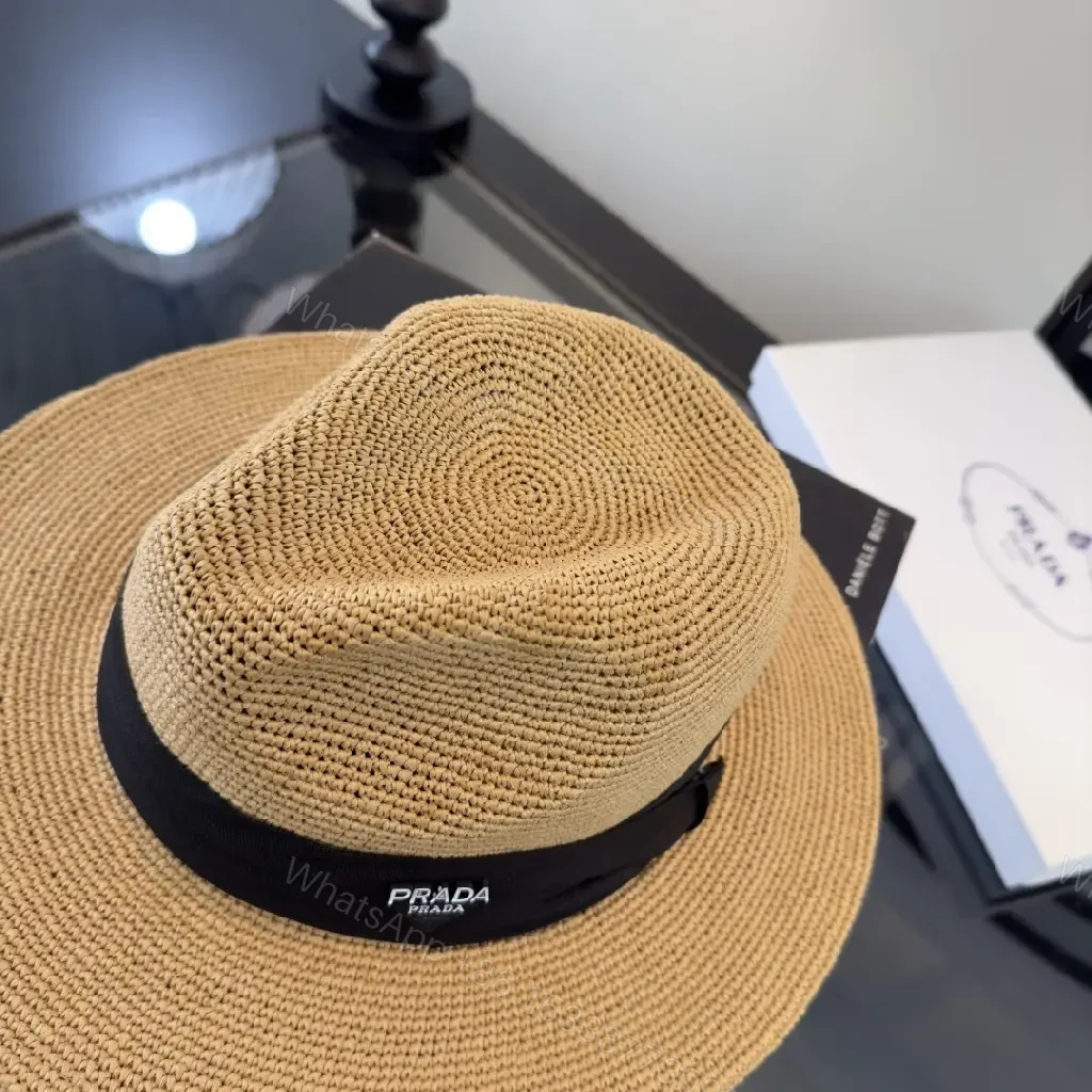View 2 of Light Tan Straw Wide-Brimmed Floppy Hat with Black Ribbon Band