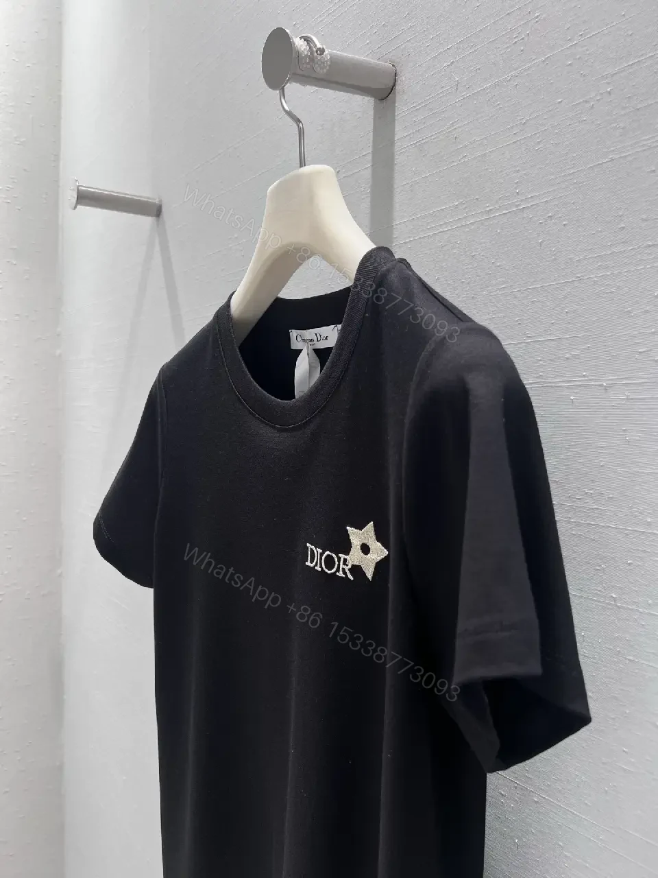 View 6 of Minimalist Black Cotton Tee with Discreet Emblem