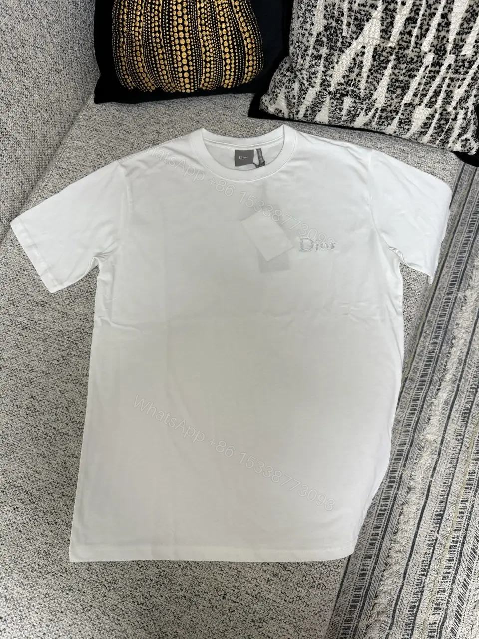 View 9 of Minimalist White Cotton Tee with Subtle Logo