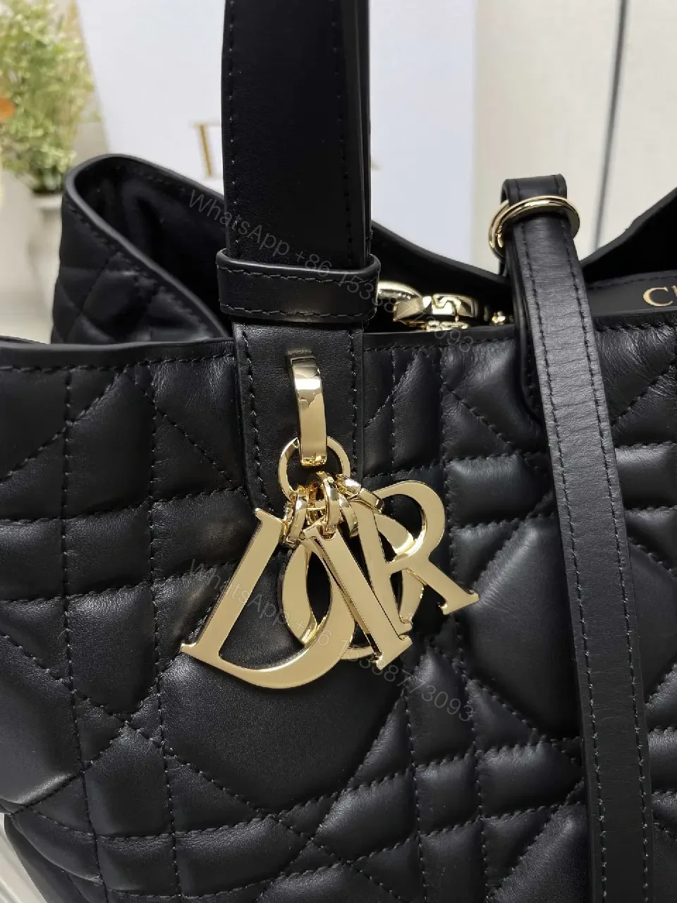 View 7 of Black Quilted Tote with Gold Charm – Luxury Everyday Bag