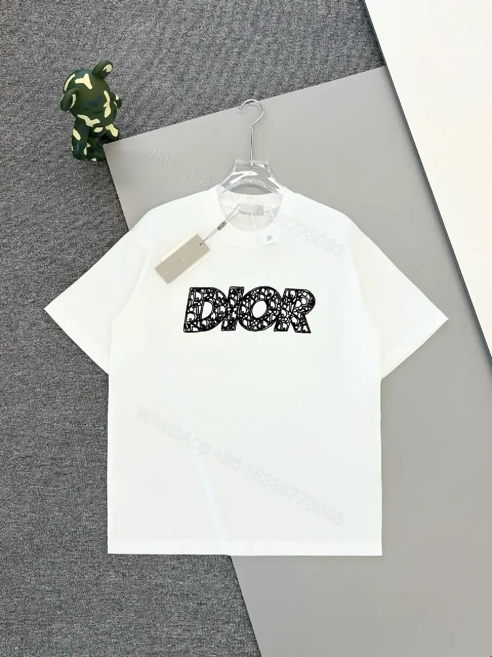 View 2 of Minimal White Tee with Bold Logo Luxury Graphic Tee