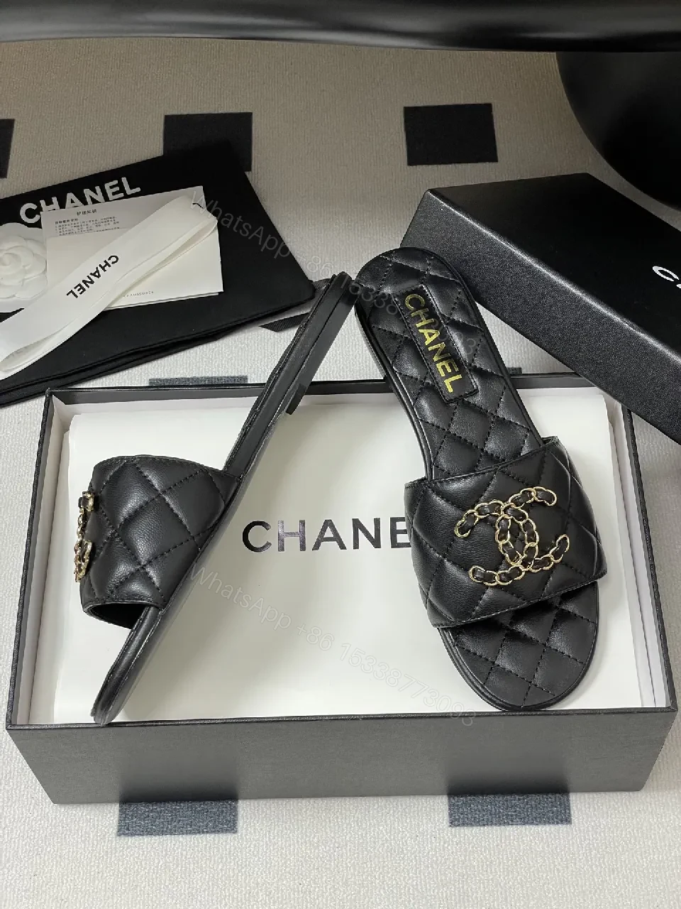 View 5 of Quilted Leather Slides with Gold Chain Detail Luxury