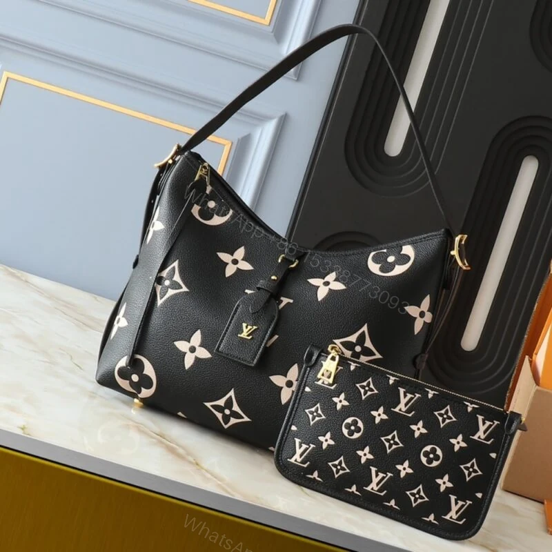 View 2 of Louis Vuitton Carryall PM Bicolor Monogram Empreinte Black 29Cm