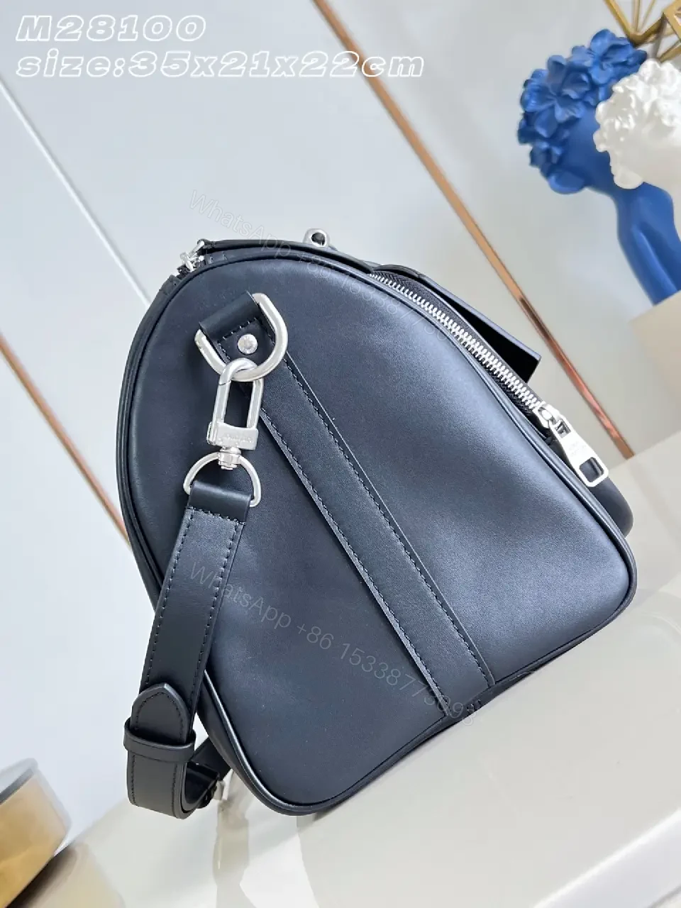 View 2 of Black leather structured satchel with top handle, removable strap, smooth finish, Louis Vuitton Paris (no brand details)