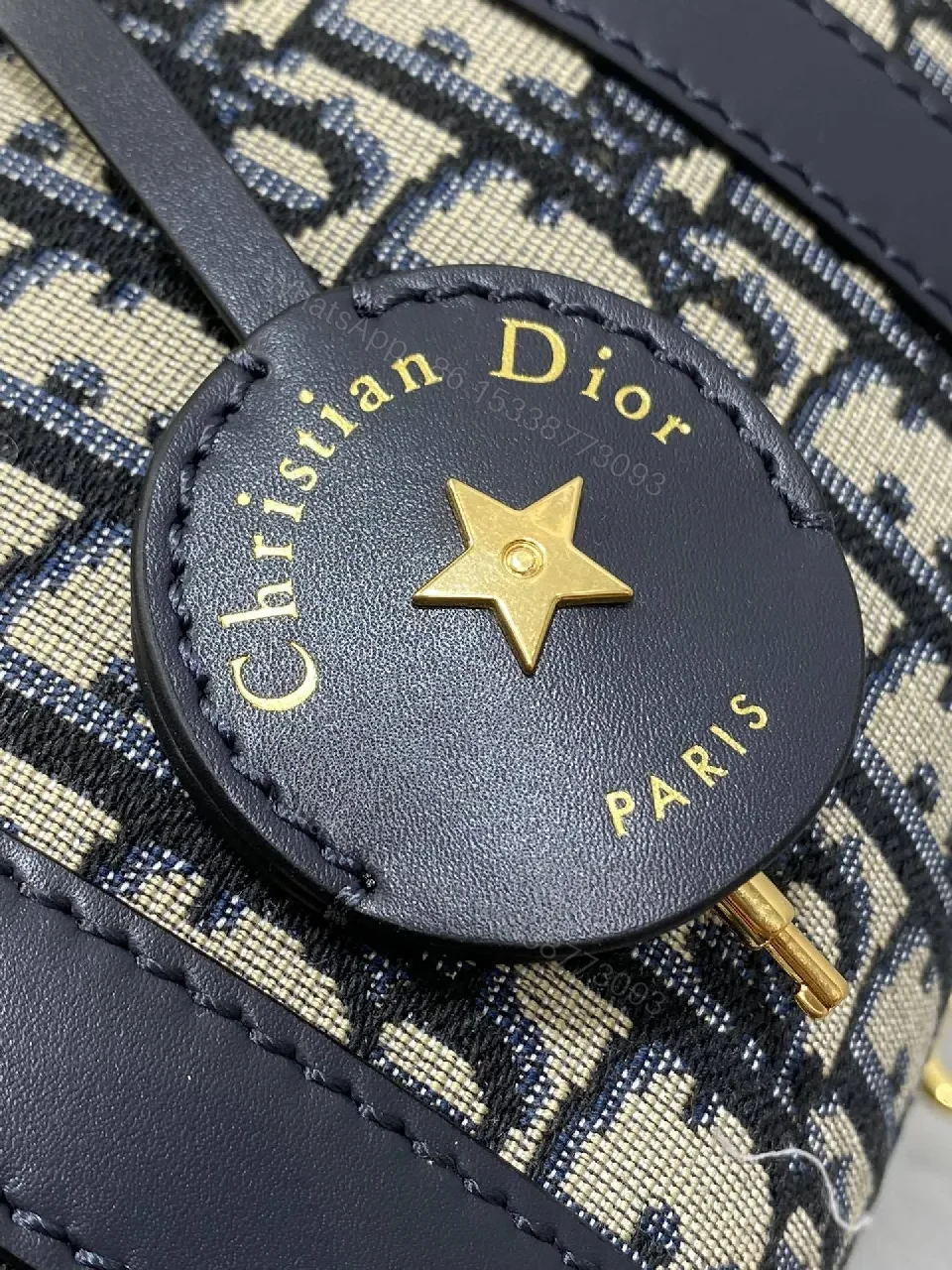 View 2 of Structured Luxe Navy Leather Mini Duffle Bag with Monogram Charm