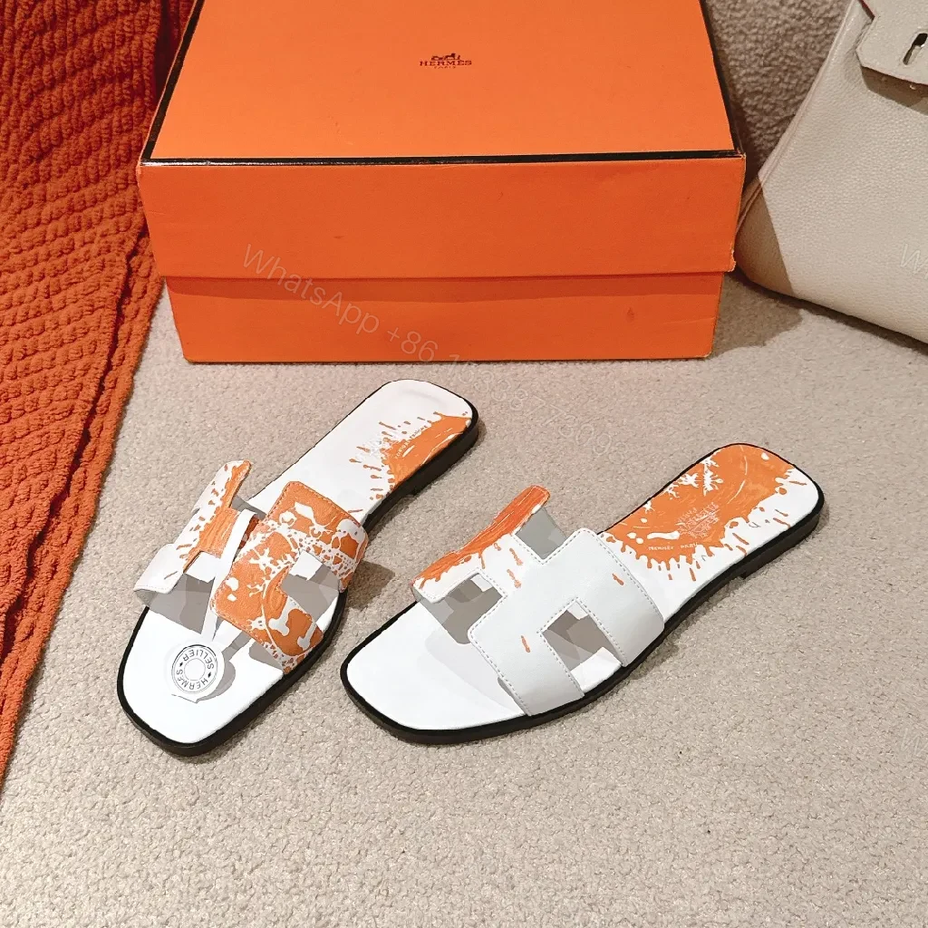 Bold Orange-Accent White Leather Slides, Comfort-Chic Street Style — view 1