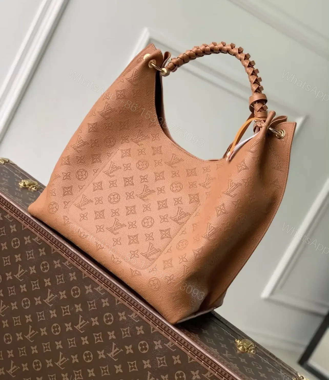 View 3 of Louis Vuitton Carmel Mahina Leather Hobo Bag in Cognac