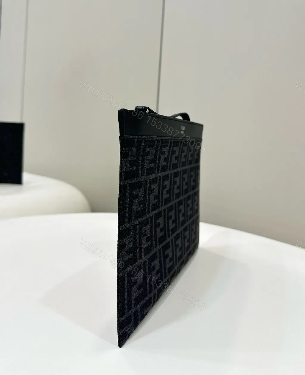 View 2 of Refined Monogram Clutch: Luxe Texture, Everyday Versatility