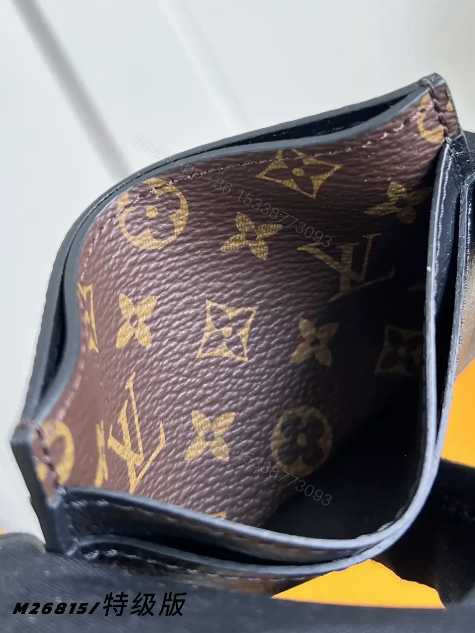 View 2 of Dark Navy Leather Bi-Fold Wallet with LV Monogram Texture