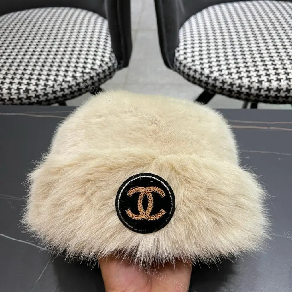 View 3 of Cream Faux Fur Pom Hat: Lux Soft Warmth, Subtle Logo Accent
