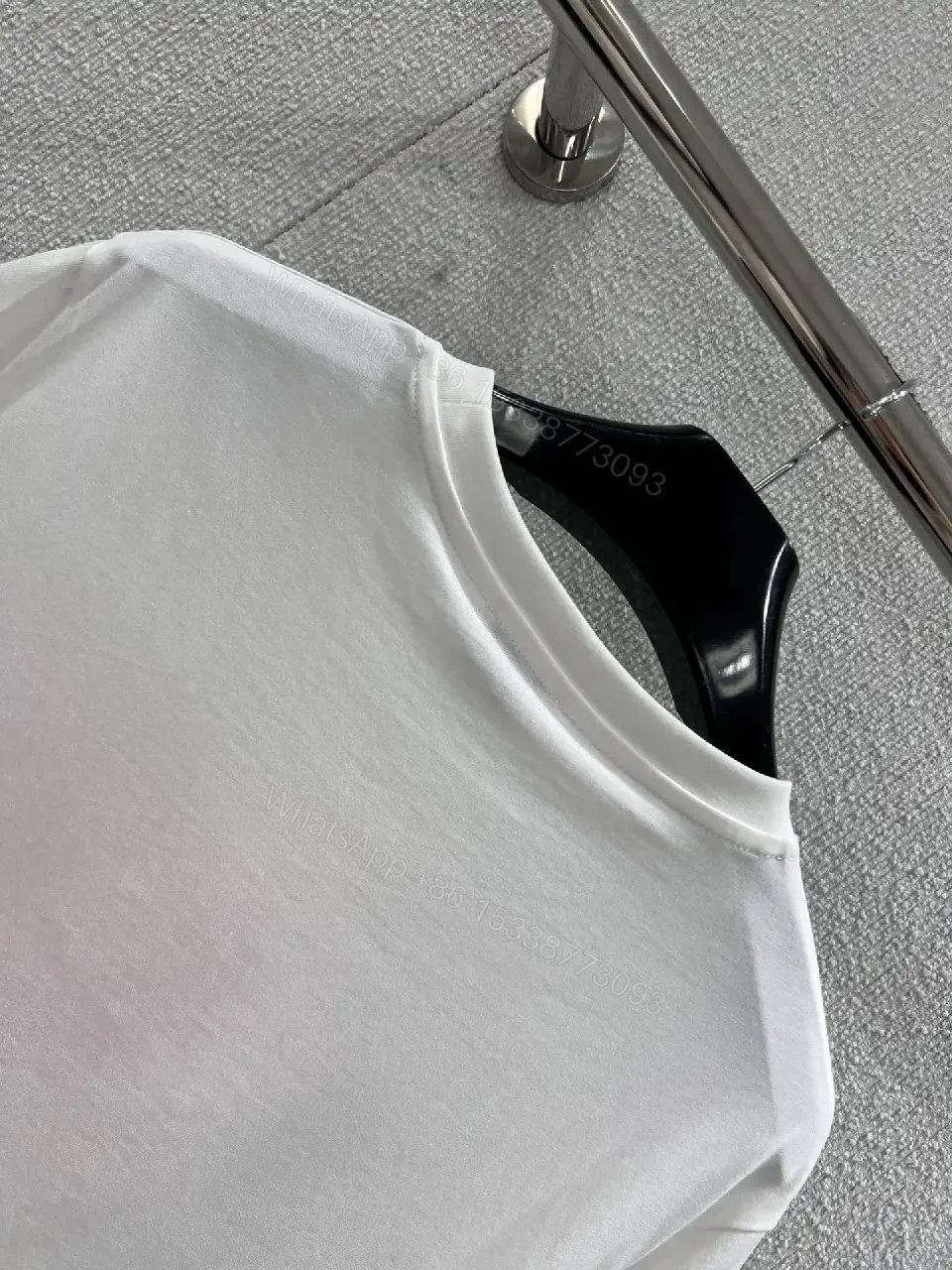 View 7 of Minimalist White Tee — Premium Cotton, Subtle Logo, Modern Style
