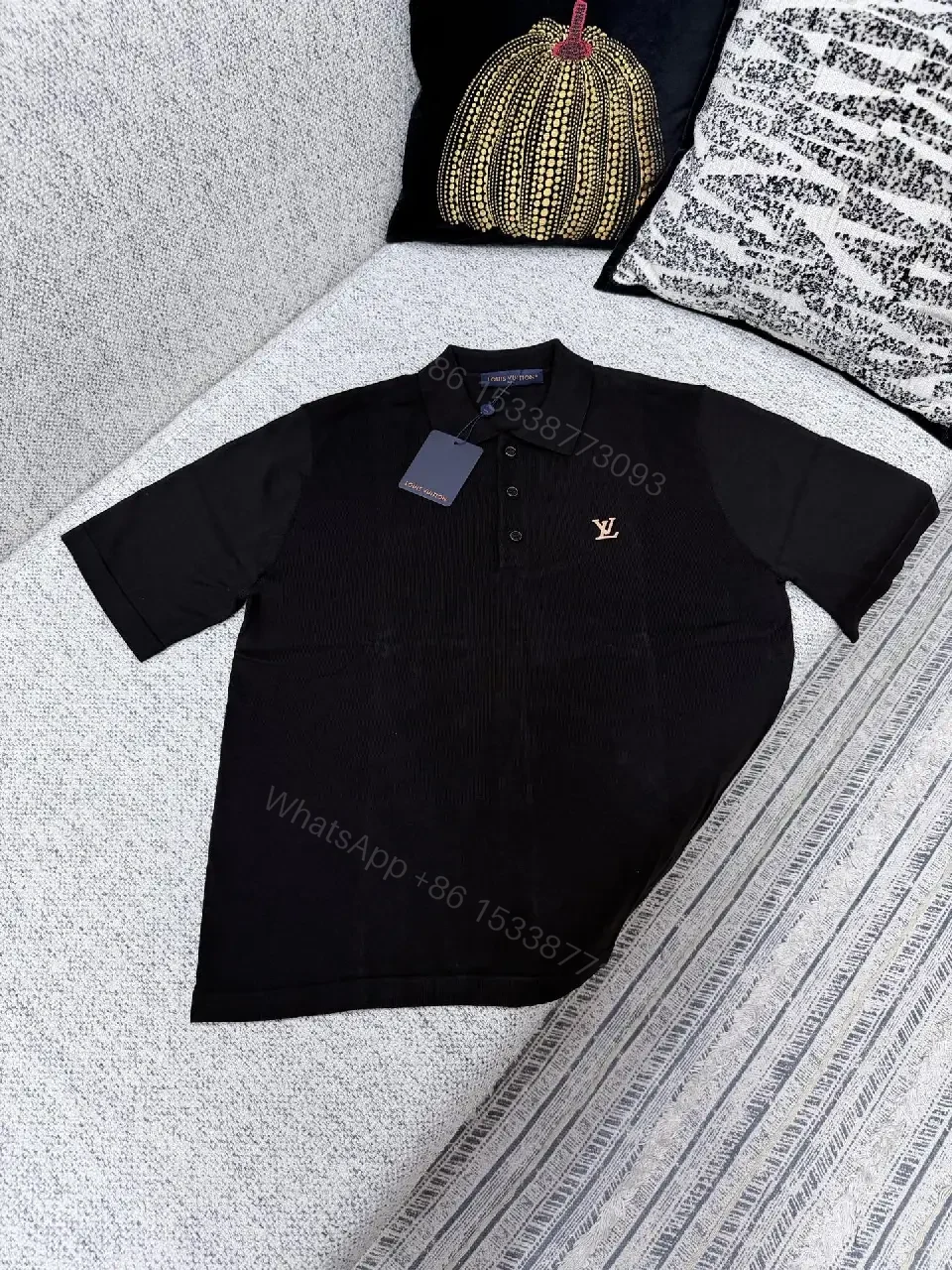 View 4 of Black Polo with Subtle Gold Logo - Refined Everyday Versatility