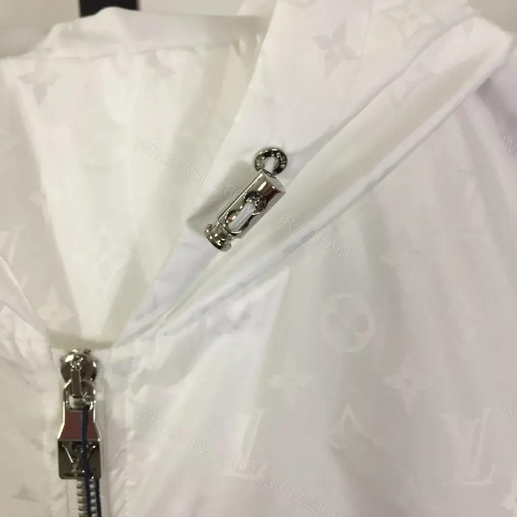 View 2 of White Zip-Front Jacket with Subtle Monogram Texture