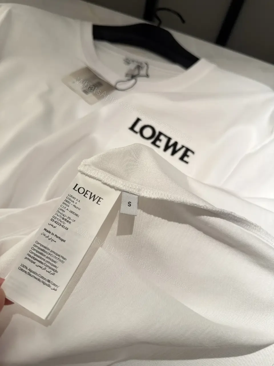 View 6 of Minimalist White Tee with Structured Pocket & Logo Emblem