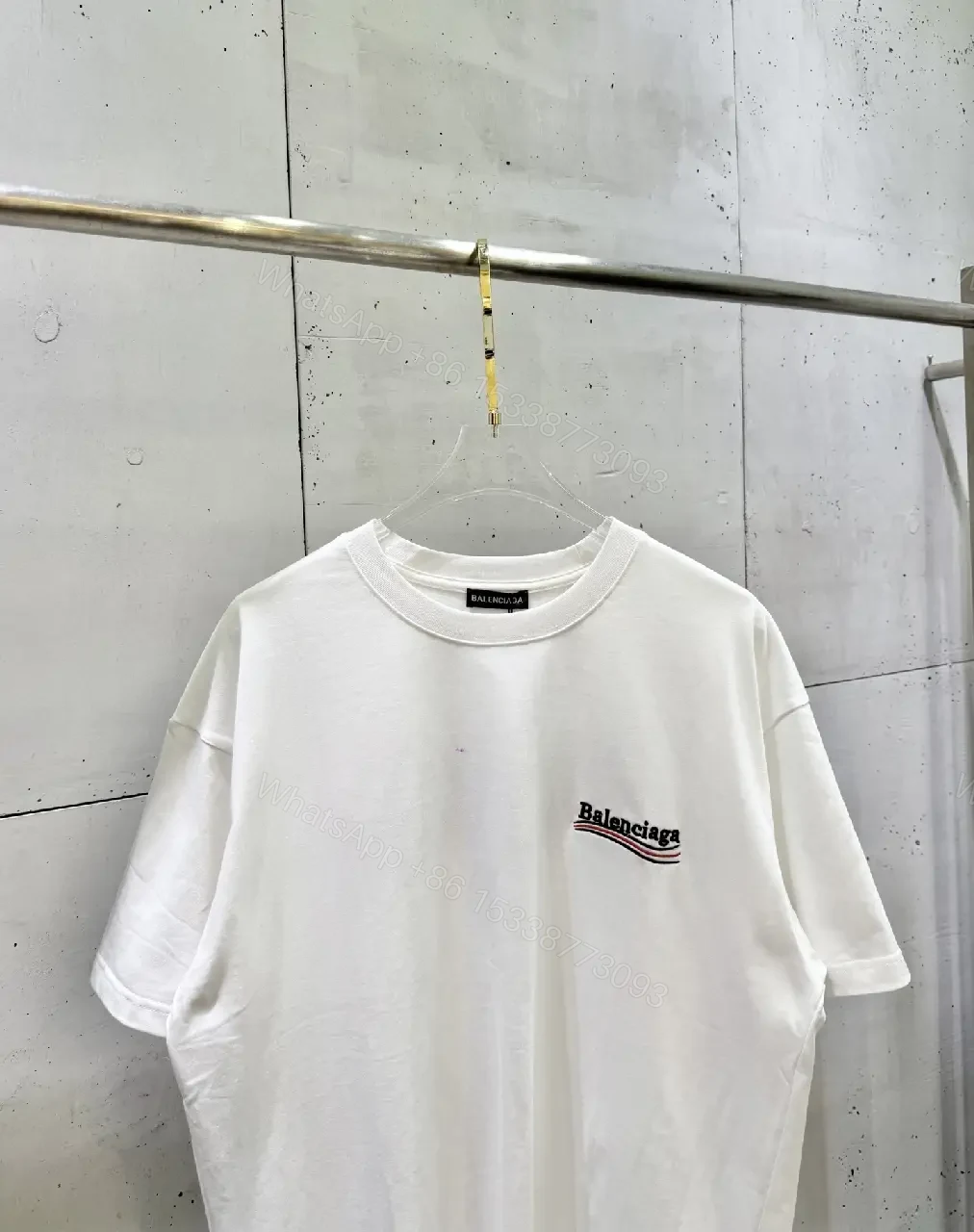 View 9 of Minimalist White Tee: Subtle Logo, Premium Cotton Short Sleeve Tee