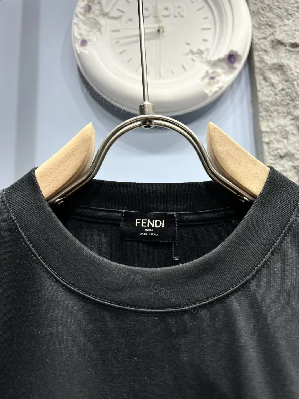 View 6 of Minimalist Black Cotton Tee with Elevated Logo Texture