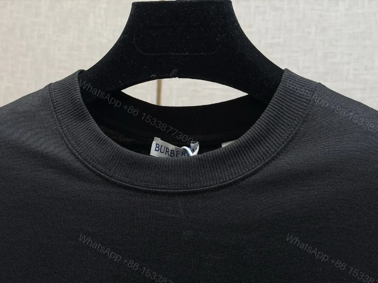 View 8 of Minimalist Black Cotton Tee with Plaid Sleeve Trim